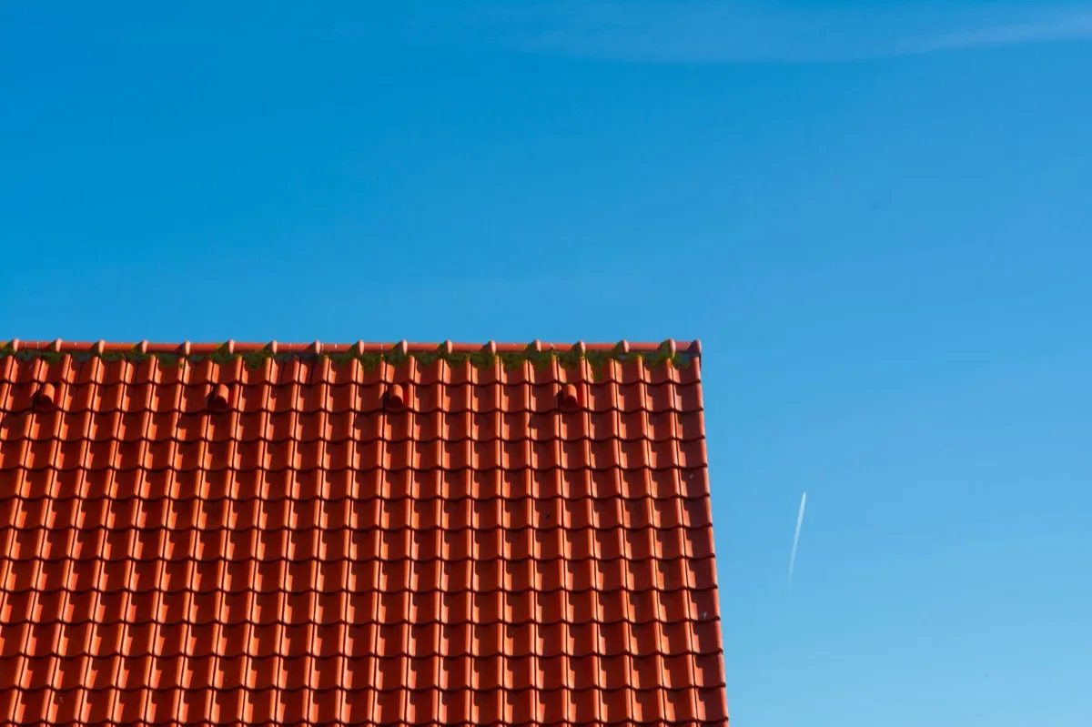 Tile roof gable in full sun, the kind of exposure that sets roof life in Brentwood, NY